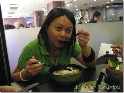 Kit Yen haivng noodles